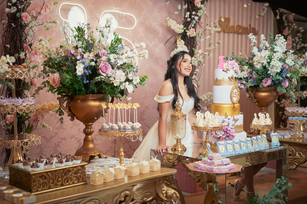 A Quinceañera Posing at her Birthday Party Reception